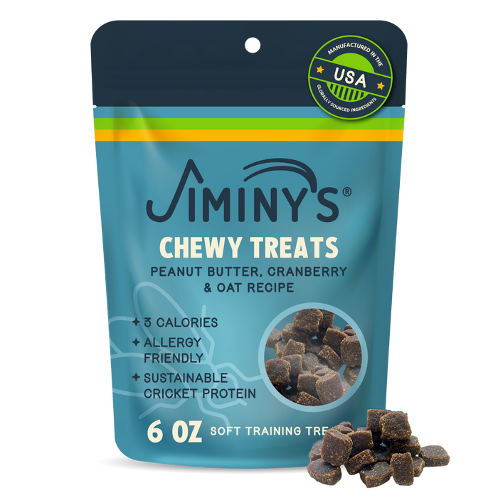A bag of Jiminy's Chewy Peanut Butter & Cranberry Training Treats for dogs, allergy-friendly and made with oats and sustainable cricket protein. The blue and yellow package displays the treats at the bottom.