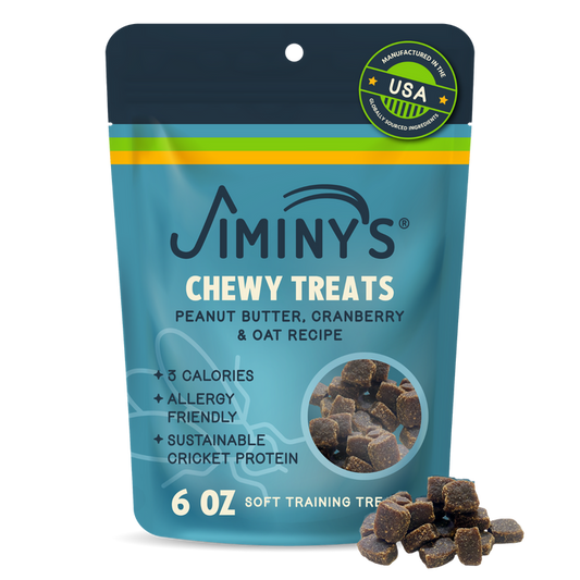 A bag of Jiminy's Chewy Peanut Butter & Cranberry Training Treats for dogs, allergy-friendly and made with oats and sustainable cricket protein. The blue and yellow package displays the treats at the bottom.