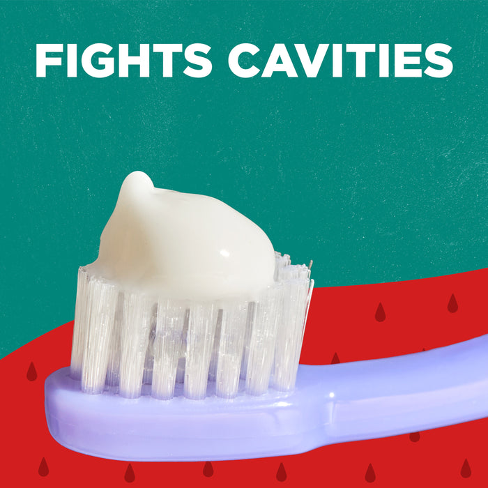 A lavender toothbrush with white toothpaste is in the foreground. The background is green at the top and red with water drop shapes at the bottom. White text above reads, "Fights Cavities.