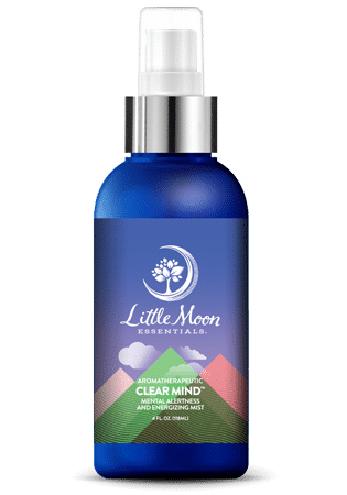The blue Clear Mind Mist spray bottle by Little Moon Essentials is infused with essential oils. Its label, featuring mountains and a moon, offers natural remedies to enhance alertness.