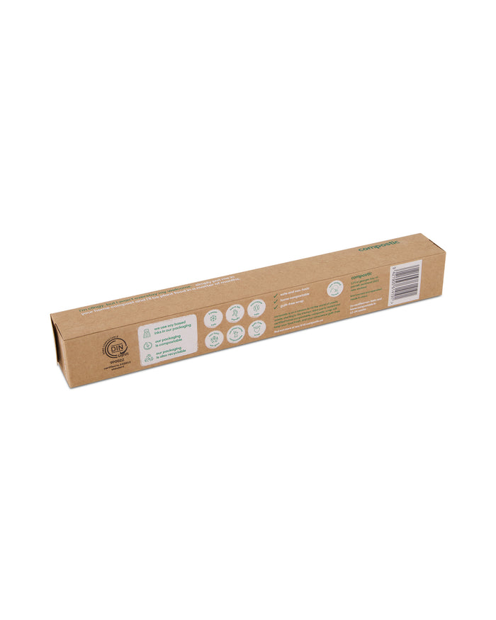 The brown, narrow cardboard box of Compostic Cling Wrap features eco-friendly symbols and text, highlighting its sustainability and home compostability. Made from renewable plant-based materials with green accents, the box also displays a barcode on one end.