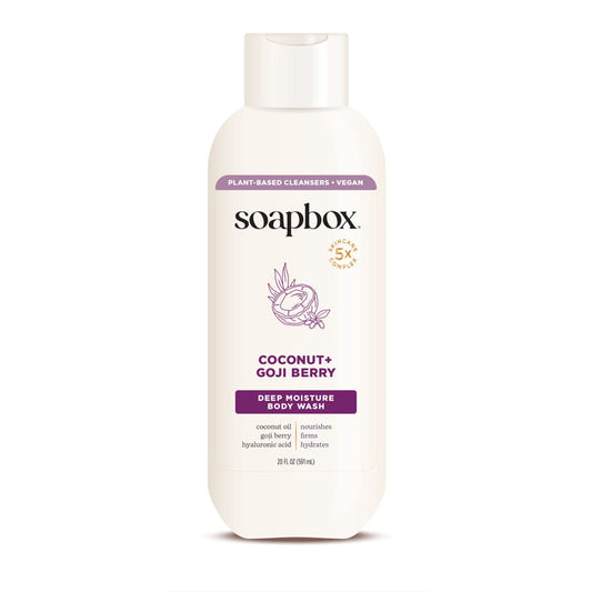 Soapboxs Coconut + Goji Berry Nourishing Body Wash, ideal for dry skin, offers 5x moisture with vegan, plant-based ingredients. This 24 fl oz (710 ml) body wash comes in a white bottle with purple and gold accents.