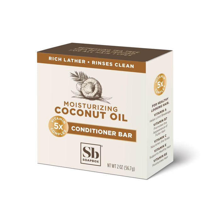 A beige box of Soapboxs Coconut Oil Moisturizing Conditioner Bar, weighing 2 oz (56.7g), features a hydrating coconut oil formula and vitamin complex. The packaging highlights a rich lather and rinses clean, with coconut imagery, suggesting its ideal for pairing with a coconut oil shampoo bar.