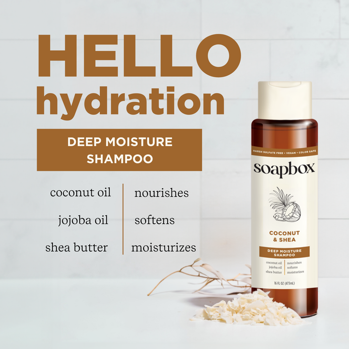Soapbox Coconut & Shea Deep Moisture Shampoo bottle with scattered coconut shavings. Text: HELLO hydration. Deep Moisture Shampoo. Key ingredients: coconut oil, jojoba oil, and shea butter; it nourishes, softens, and moisturizes hair.