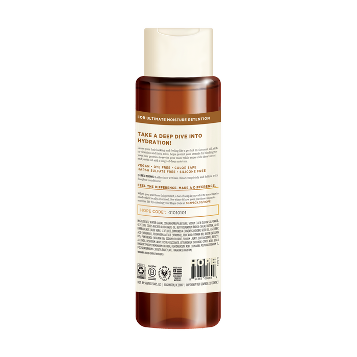 A brown bottle with a cream-colored cap features the Coconut & Shea Deep Moisture Shampoo by Soapbox, highlighting its hydrating benefits. Vegan, color-safe, and silicone-free, it contains a vitamin complex with instructions and an ingredient list in small print.