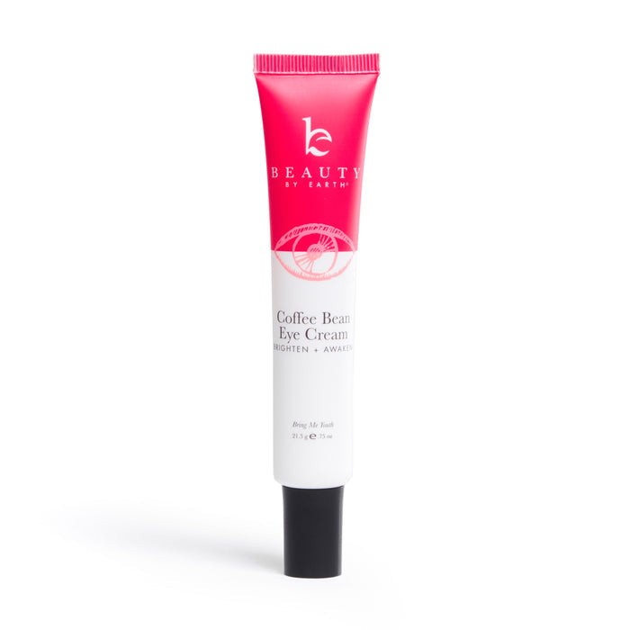 Beauty by Earths Coffee Bean Awakening Eye Cream features a white tube with pink accents and a pink cap. Infused with coffee seed extract, it touts the phrase Brighten + Awaken and is crafted to reduce dark circles. The 0.5 fl. oz. (15 mL) size makes it convenient to apply.