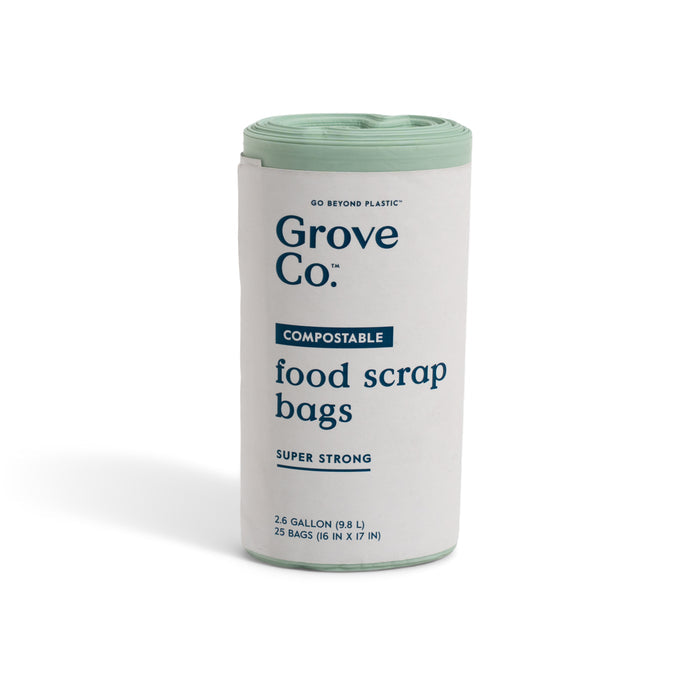 A roll of Grove Co. Compostable Food Scrap Bags with a white and light green label, featuring 25 super strong 2.6-gallon bags—ideal for kitchen composting.