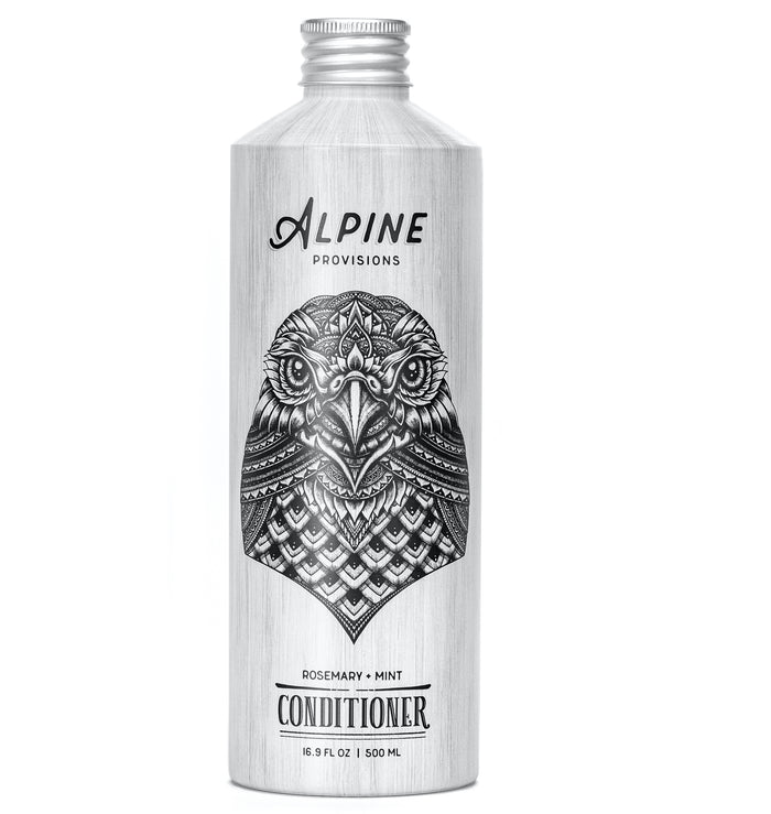 Alpine Provisions silver 16.9 fl oz (500 ml) conditioner bottle, featuring an intricate owl design, offers a refreshing rosemary and mint scent for natural hair care nourishment.