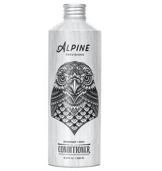 Alpine Provisions silver 16.9 fl oz (500 ml) conditioner bottle, featuring an intricate owl design, offers a refreshing rosemary and mint scent for natural hair care nourishment.