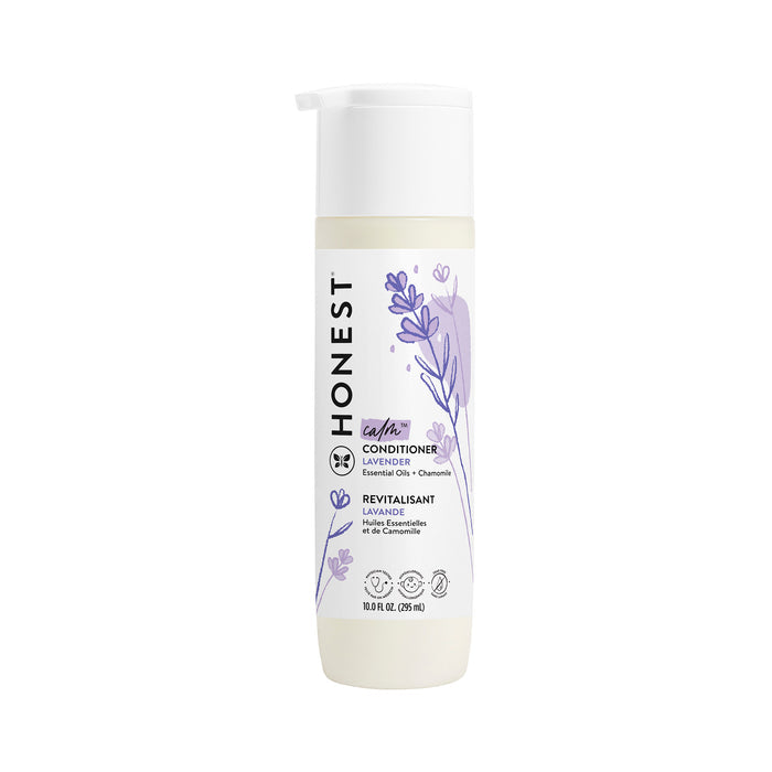 A 10.0 FL OZ bottle of The Honest Company silicone-free lavender conditioner with jojoba oil, featuring a pump dispenser and a white and purple label adorned with lavender sprigs, reads essential oils + chamomile.