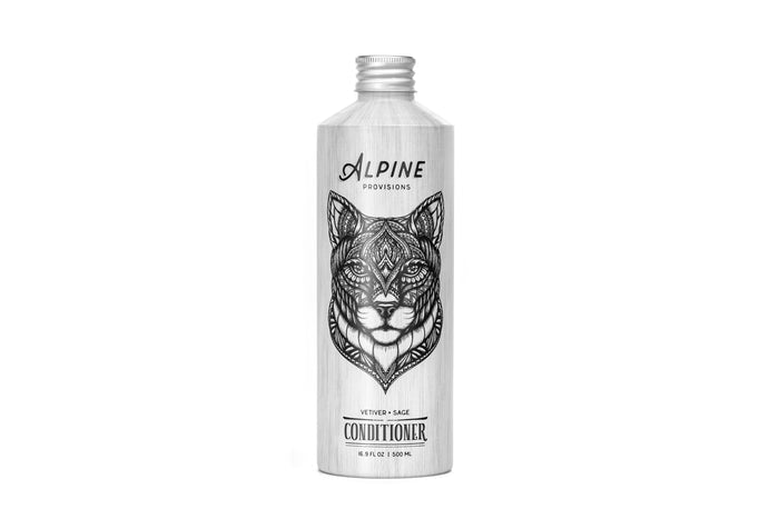 Explore Alpine Provisions Conditioner, featuring a sleek aluminum bottle adorned with intricate black and white animal art. Infused with natural ingredients, this Vetiver + Sage formula is designed to moisturize and promote healthier hair.