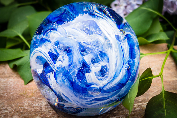 Ashes in glass orb for rememberance of people and pets