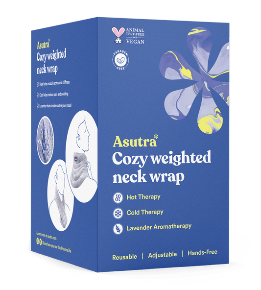 The blue box of Asutras Cozy Weighted Neck Wrap displays icons for warm/cool therapy and soothing lavender aromatherapy. Its vegan, cruelty-free, has a floral design, and shows someone enjoying its comfort.