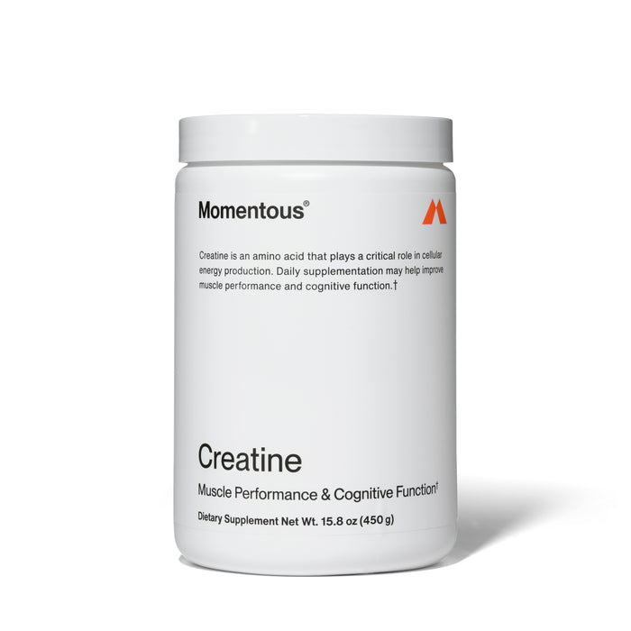 A white jar of Momentous Creatine with black text touts its muscle performance and cognitive benefits, weighing 15.8 ounces (450g).