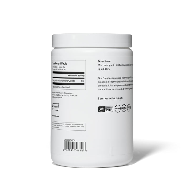 The sleek white container of Momentous Creatine features supplement facts, usage directions, and certification logos. Its label highlights 5g of high-purity Creapure® creatine monohydrate per serving, designed to support muscle strength and cognitive function.