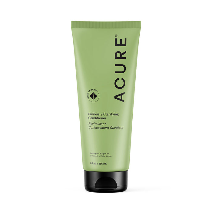 An 8 fl oz (236 ml) green tube of Acure Curiously Clarifying Conditioner with a black cap, featuring lemongrass and argan oil, organic hair care benefits, and English and French text on the label.