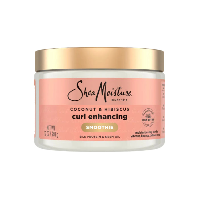 A 12 oz jar of SheaMoisture Styling Aid Smoothie Curl Enhancing, featuring a gold lid and pink label. This curl enhancing smoothie is formulated to fight frizz while moisturizing and defining curls with nourishing silk protein and neem oil.