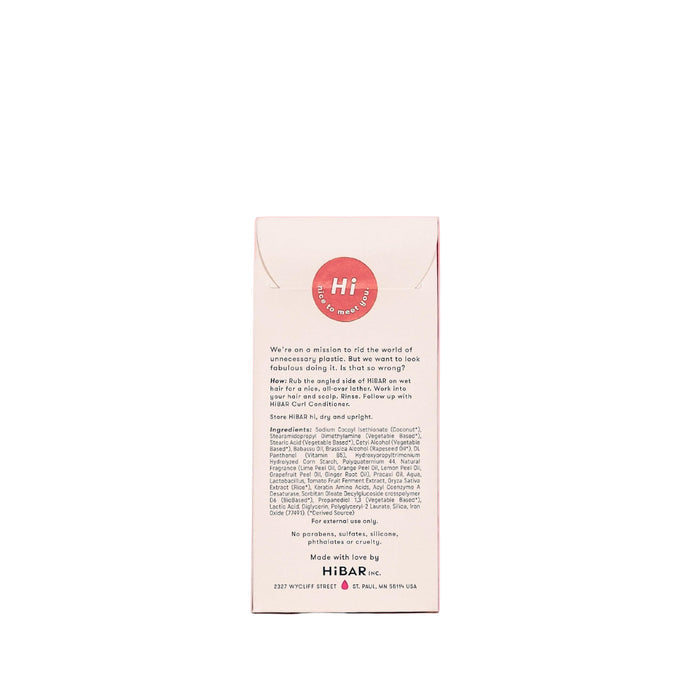 The HiBAR Curl Shampoo box highlights its ingredients, like rice protein for strength, in sustainable packaging. A distinctive red circle with Hi at the top underscores the brands eco-friendly ethos.