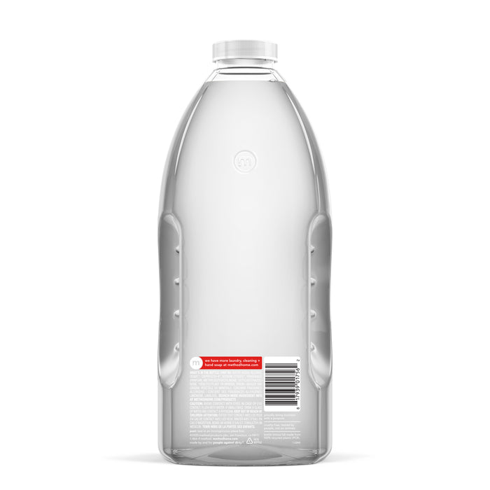 The clear plastic bottle with a textured grip is partially filled with water and perfect for refilling your method Daily Granite Cleaner Refill. The back label features text and a barcode, while the transparent cap enhances the sleek design to fit any decor seamlessly.