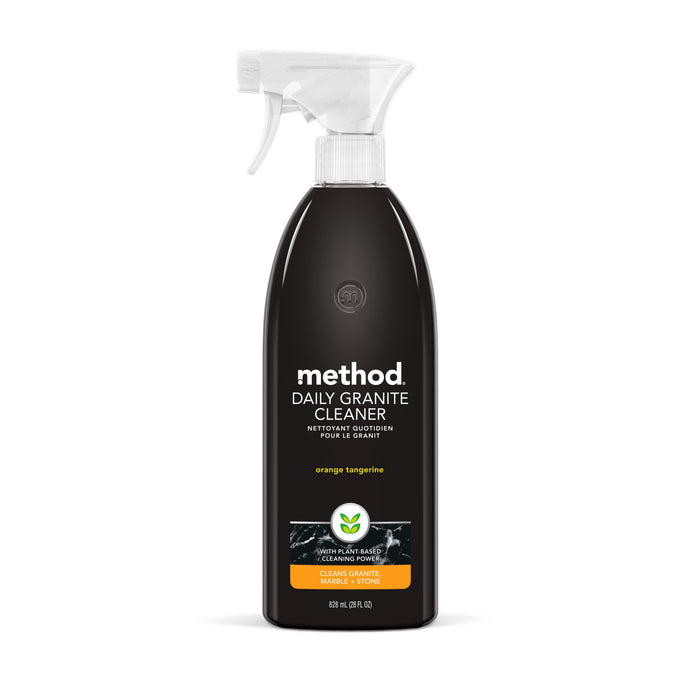 The Method Daily Granite Cleaner is a black spray bottle with a white nozzle, perfect for marble and granite surfaces. Its label shows the brand name method and describes it as orange tangerine for cleaning natural stone, with an 828 ml (28 fl oz) capacity.
