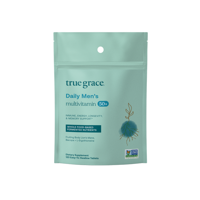 A teal pouch labeled True Grace Daily Mens 50+ Multivitamin - Refill Pouch offers immune, energy, longevity, and memory support with whole food-based fermented nutrients. It holds 120 tablets and proudly displays the Non-GMO Project Verified logo at the bottom.