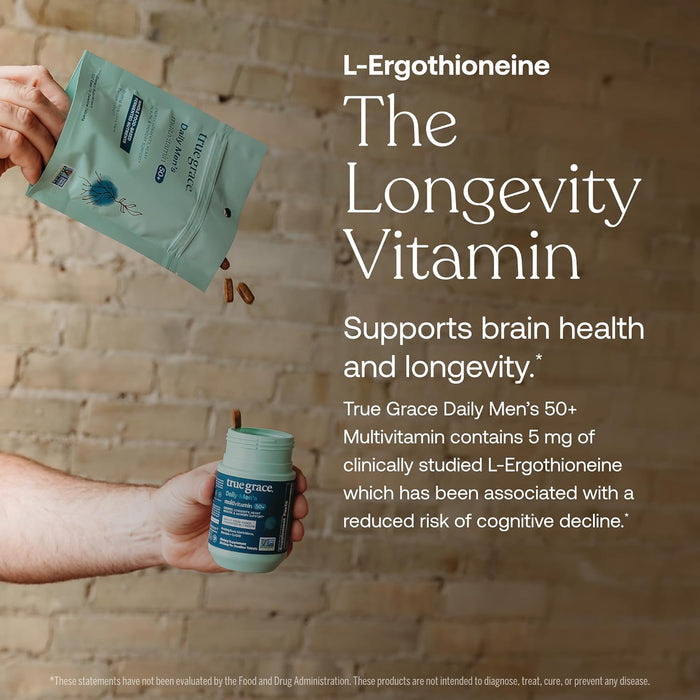 A hand pours capsules from a True Grace Daily Men’s 50+ Multivitamin pouch into another hand with the container, highlighting L-Ergothioneine as The Longevity Vitamin for memory and longevity support in men 50+ multivitamins.