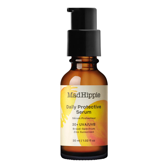 A brown pump bottle labeled Mad Hippie Daily Protective Serum showcases an abstract yellow and orange design and contains mineral SPF 30+ UVA/UVB Broad-Spectrum Zinc Sunscreen. Its enriched with nourishing buriti oil. Size: 30 ml / 1.02 fl oz.
