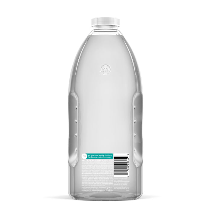 Back view of a clear plastic Daily Shower Refill bottle by method, featuring powergreen™ technology. Its smooth, curved design with slight indentations provides grip. The vegan-friendly product displays a sleek blue label, transparent cap, and barcode near the bottom.