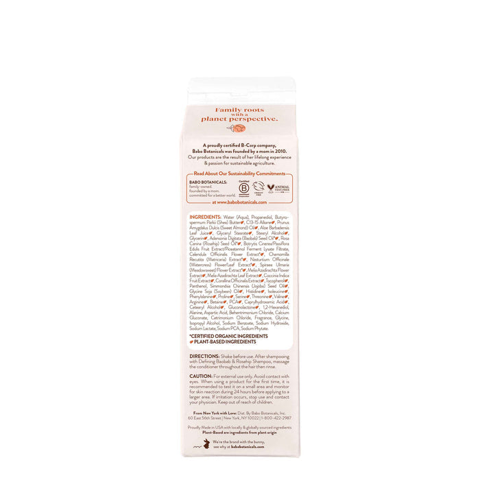 A side view of Babo Botanicals Defining Baobab & Rosehip Conditioner carton highlights sustainability, organic ingredients, and vegan components. The top features small icons reflecting the brands sustainable haircare values. Background is white.