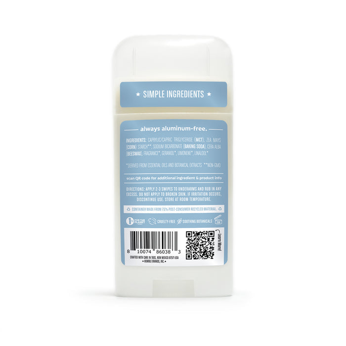 Back view of a Humble Brands Deodorant - Aluminum Free stick on a blue background, with a label displaying ingredients, a QR code, and simple ingredients. The label emphasizes that the product is cruelty-free, made with recycled packaging, and offers application instructions.