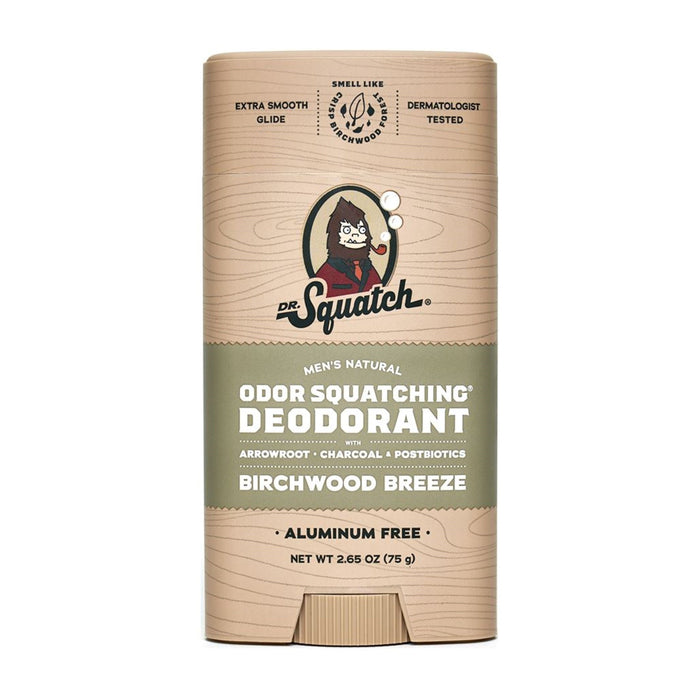 The image shows a cylindrical stick of Dr. Squatch Deodorant labeled Odor Squatching Deodorant, providing odor protection in the Birchwood Breeze scent. It includes natural deodorizers like arrowroot and charcoal, skin-nourishing moisturizers, features a cartoon character on the packaging, and is dermatologically tested.