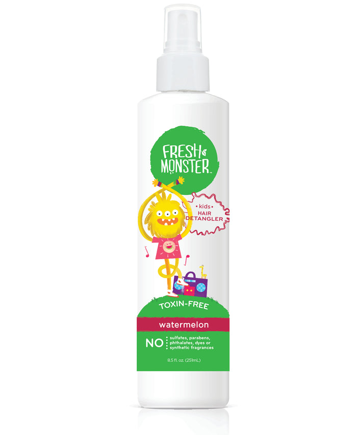 This 8.5 fl oz Fresh Monster Detangler Spray for Kids features a whimsical label with a crowned yellow monster playing guitar amid music notes. The watermelon-scented, hypoallergenic spray is toxin-free, containing no sulfates, parabens, or synthetic fragrances.