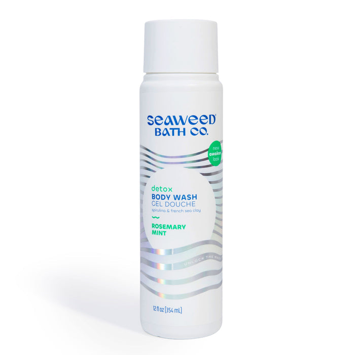 The Seaweed Bath Cos Detox Purifying Body Wash comes in a white bottle featuring a silver wave design. Infused with Green Coffee Bean Extract and Bladderwrack Seaweed, it offers rosemary and mint freshness for normal to dry skin.