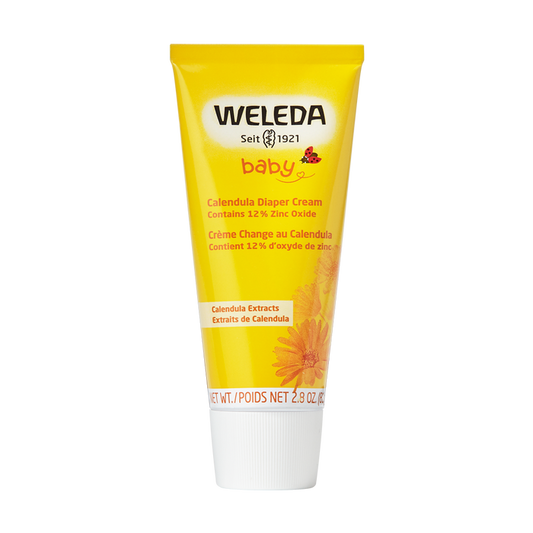 A yellow tube of Weleda Diaper Cream with a white cap features baby, Seit 1921, and product details, alongside a calendula flower image at the bottom. Its 2.8 oz / 81 g, part of Calendula Baby Care, and eligible for TerraCycle recycling.