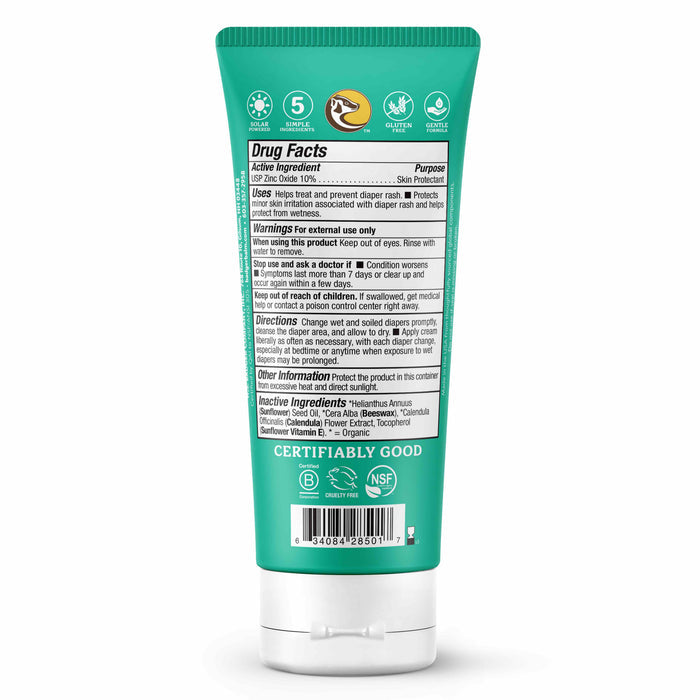 A green tube of Badger Balm Diaper Cream faces backward, showcasing information like active ingredients, warnings, uses, and directions. Featuring non-nano zinc oxide and organic calendula, the packagings bottom includes a barcode and certification logos.