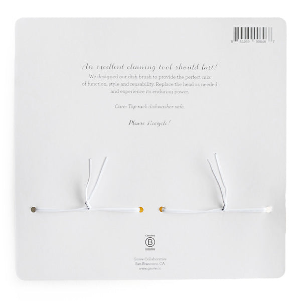 The image displays the back of a card with white string ties, featuring text about Grove Co. Dish Brush Replacement Heads, including durability and care details, replacement head options, a barcode, a recycling reminder, and at the bottom, the Grove Co. logo and company information.