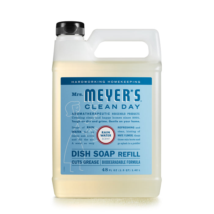 A 48 fl oz bottle of Mrs. Meyers Dish Soap Refill features a blue label with a woman cleaning and emphasizes its biodegradable formula, cruelty-free nature, rainwater scent, and excellent grease-cutting abilities.