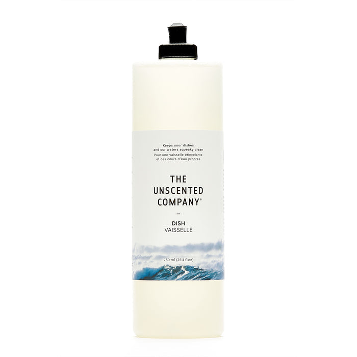 A 750 ml tall, clear bottle of The Unscented Company Dish Soap with a black flip-top cap and minimalist label featuring waves, containing vegan and fragrance-free dish soap.