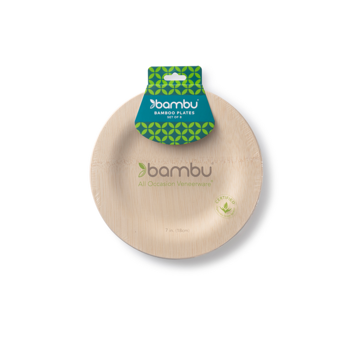 A round 7-inch bamboo plate with a green leaf-patterned label shows the brand Bambu and reads Disposable Bamboo Plates. This eco-friendly dinnerware is ideal for any event and features the label All Occasion Veneerware.