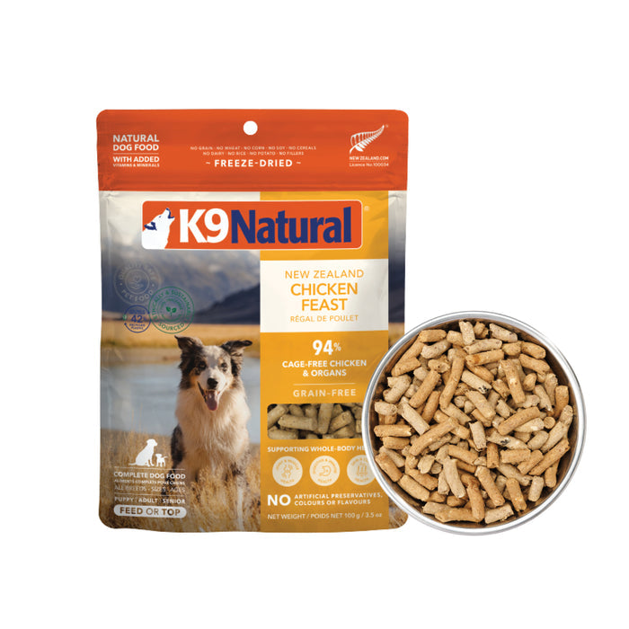 A bag of K9 Natural Dog Food - Grain-Free, Freeze-Dried stands beside a full bowl. The packaging displays a dog, scenic mountains, and an orange and yellow label with product details.