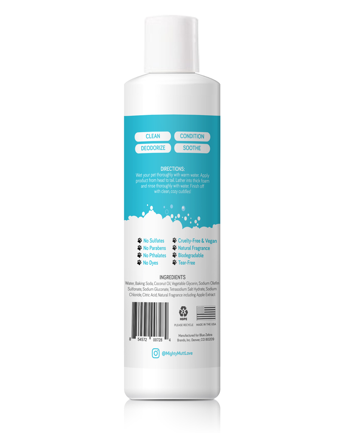 Introducing Mighty Mutts Dog Shampoo and Conditioner in a white bottle with a blue label featuring icons and text. This hypoallergenic, cruelty-free, vegan formula cleans, deodorizes, conditions, and soothes your pet’s coat. It’s eco-friendly and free of sulfates, parabens, phthalates, dyes, and fragrances.