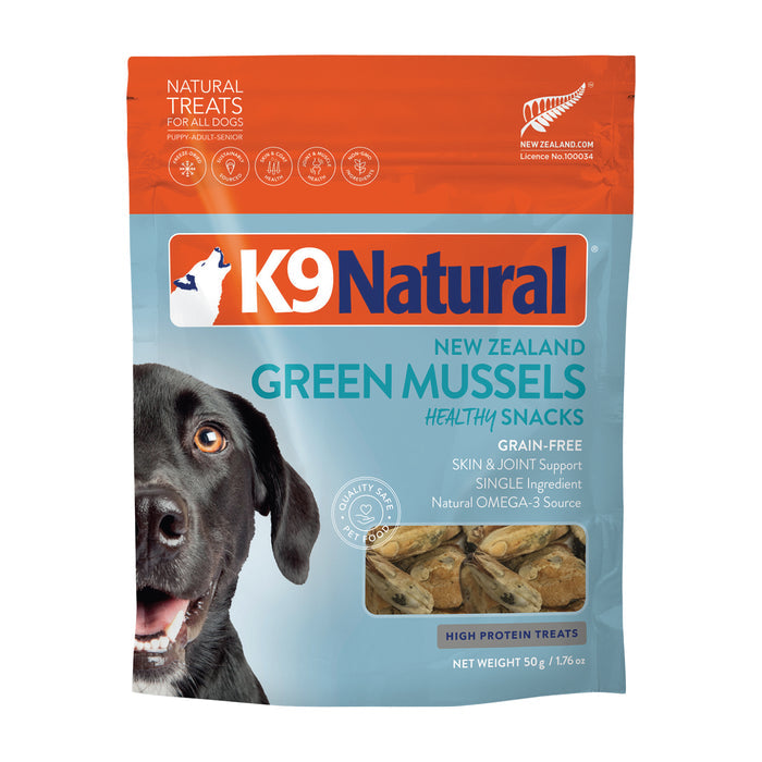 K9 Natural Grain-Free Freeze-Dried Dog Treats with New Zealand green mussels come in orange and blue packaging, featuring a dog photo. These treats are high in protein, grain-free, and rich in Omega-3 for skin and joint support.