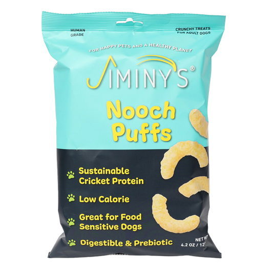 Jiminys Dog Treats come in a blue and teal 4.2 oz bag, featuring sustainable cricket protein, nutritional yeast for taste, low calories, suitability for food-sensitive dogs, and digestive benefits.