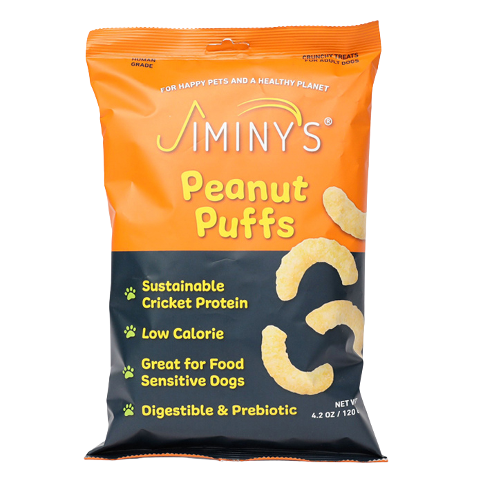 Jiminys Dog Treats are peanut puffs infused with nutritional yeast for a protein boost. The vibrant orange packaging showcases sustainable cricket protein, low calories, prebiotics for digestion, and is perfect for food-sensitive dogs.