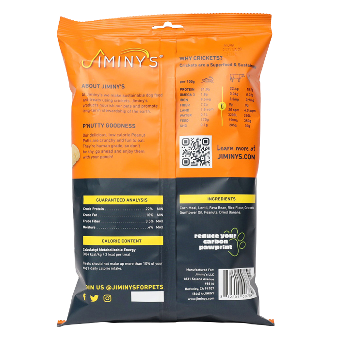 On the back of Jiminys Dog Treats bag: sustainable cricket protein with nutritional yeast for added protein. Includes nutritional analysis, calories, ingredients, a QR code for details, and highlights carbon footprint reduction along with social media info.