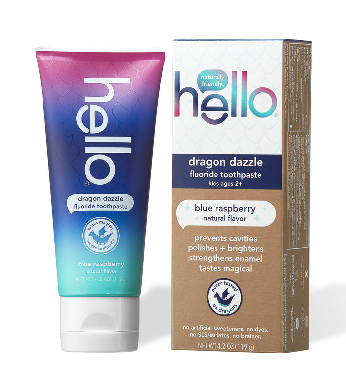 The hello Dragon Dazzle Toothpaste, for ages 2+, features xylitol and natural blue raspberry flavor. It prevents cavities, polishes, brightens, and strengthens enamel. The package shows a pink-blue gradient with scale patterns.
