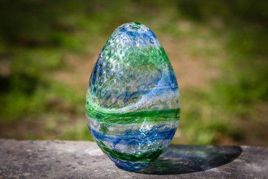 Blue and green infused glass dragon egg with bubble texture designed to hold cremains
