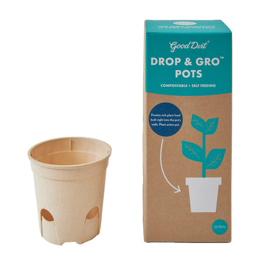 A beige plant pot is next to a teal and brown box labeled Good Dirt Drop & Gro Pots. The box, featuring a plant illustration, describes the compostable seed-starting pots as self-feeding and nutrient-rich, with 10 pots included.