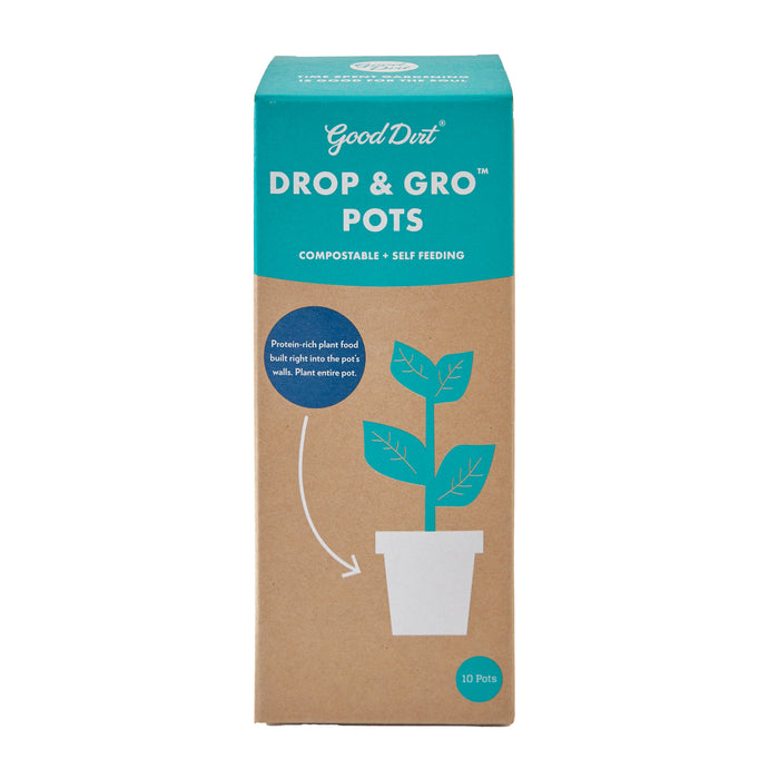 A Good Dirt cardboard box labeled Drop & Gro Pots contains 10 compostable self-feeding seed starting pots. An illustration shows a sprouting plant in a pot with an arrow, suggesting planting the entire pot for optimal growth.
