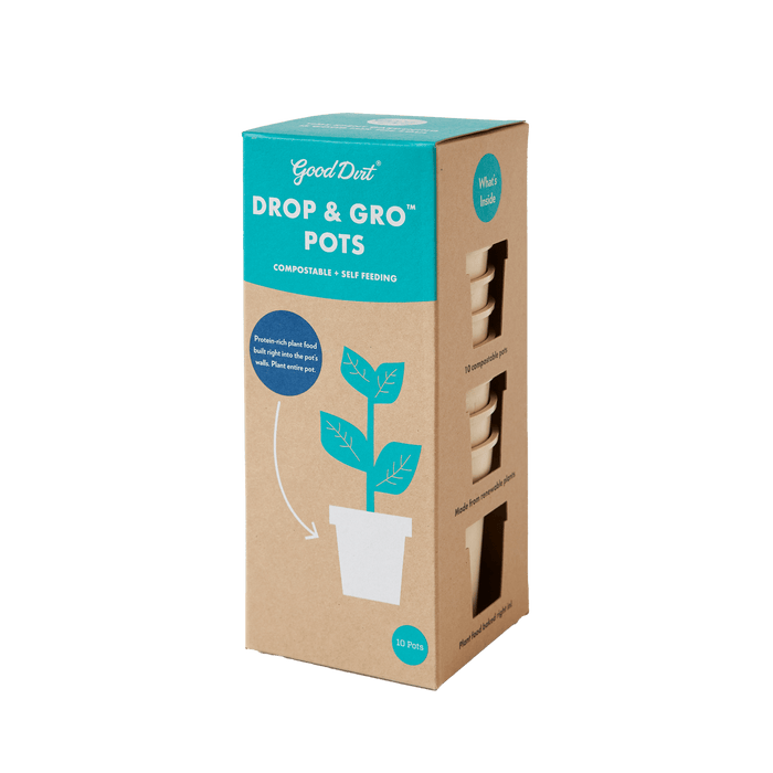 Cardboard packaging for Good Dirts Drop & Gro Pots features a plant illustration and the label Compostable • Self-Feeding with Plant Nutrients. Three cut-outs reveal the compostable seed-starting pots inside, with text above saying, Whats inside. The package contains 10 pots.